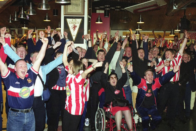 Sunderland supporters watch their team play Bury in 1999 and look at the scene of celebration in the Sports Bar at the Stadium of Light.