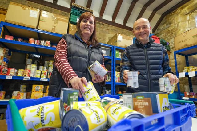 Volunteers at the Chapel Green Foodbank based at St Saviours Church in High Green.
David Field sorting through a box of donated food with Susan Fiander