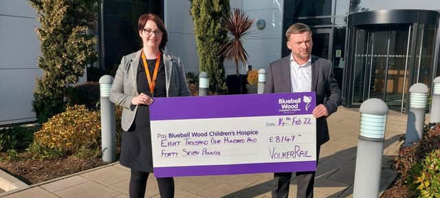 Stuart Webster-Spriggs, VolkerRail’s HSQES director, presents a cheque for a portion of the company's recent donation to Bluebell Wood’s Regional Fundraiser Eleanor Hughes