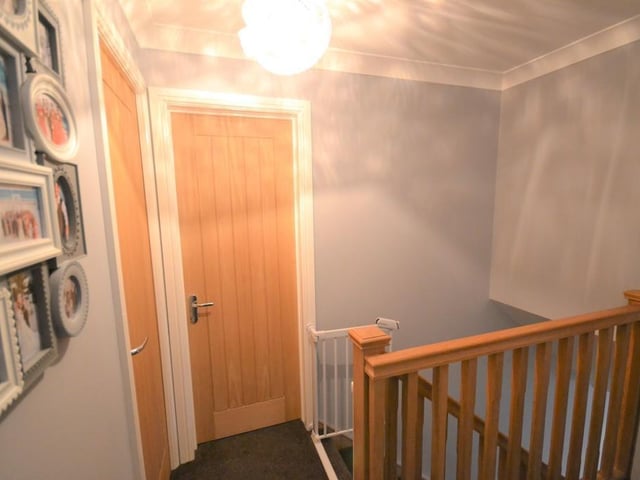First floor landing - Stairs rise to the first floor with crafted Oak spindles and handrails, matching Oak internal doors open to all four bedrooms and the family bathroom.