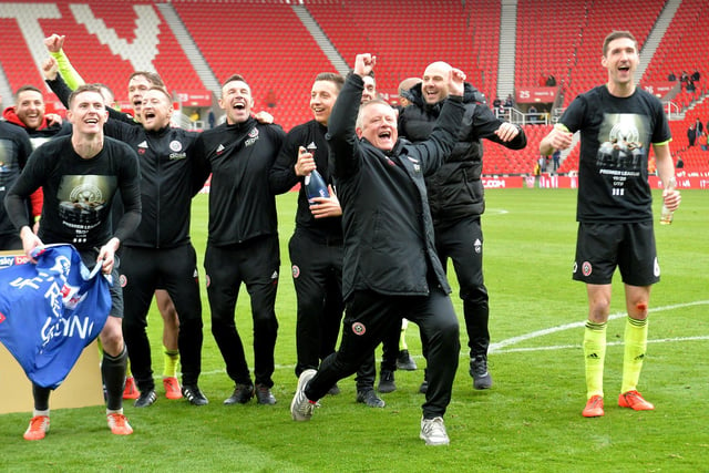 Wilder celebrates a second promotion but this time to the Premier League after his side's final game of the Sky Bet Championship season at Stoke City in May 2019.