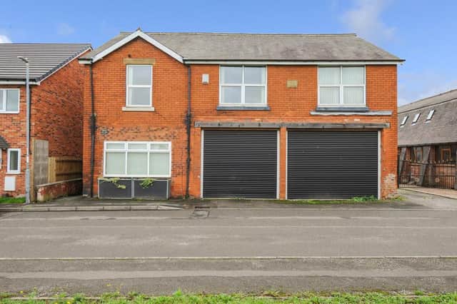 The five-bedroom detached home comes with two "substantial" garages with electric doors.