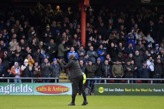 Owls boss Darren Moore thanks the fans after a 2-0 win at Crewe
