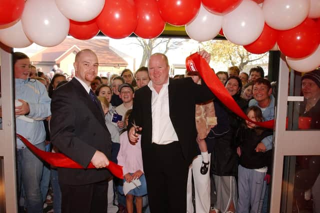 Actor Steve McFadden, better known as Phil Mitchell from EastEnders, is seen with staff and customers at the opening of the Southwick Kwik Save in 2004. Were you there?