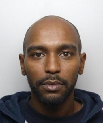 Detectives investigating the murder of 21-year-old Kavan Brissett are appealing to find the man pictured.
Ahmed Farrah, 29, who is also known as Reggie, is wanted in connection to Mr Brissett’s murder, as the investigation progresses.
Mr Brissett was stabbed once in the chest on Tuesday 14 August, 2018 near to Langsett Walk, Sheffield. He died in hospital four days later on Saturday 18 August, 2022 as a result of his injuries.
Detective Chief Inspector Jude Ashmore, the Senior Investigating Officer, said: “Efforts to find and arrest Farrah, who is known to frequent the Broomhall area of Sheffield, have been ongoing but so far we haven’t been able to locate him.
“I’d now like to ask for your help – if you know where he is, or have seen or spoken to him recently, then please contact us. If you do see him, do not approach him but instead call 999 straight away.
“I’d also like to remind anyone who is letting Farrah stay with them, or helping him to evade arrest by any means, that you are committing a criminal offence which could result in prosecution.
“Farrah knows he is wanted and is deliberately avoiding police and I’d ask anyone who has any information, and Farrah himself, to think about Kavan’s family and the pain they are suffering. Do the right thing and contact police.”
If you see Farrah, please call 999. If you have any other information as to where he might be, please call either 101 or the incident room to speak to detectives directly on 01709 443507.
You can also speak to Crimestoppers on 0800 555111. Please quote incident number 827 of 14 August 2018 when passing on information.