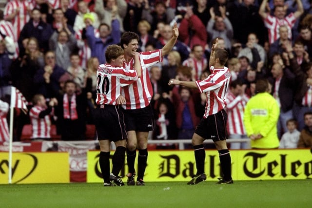 Niall Quinn celebrates his goal against Tottenham Hotspur with teammates Stefan Schwarz and Kevin Phillips during the FA Carling Premiership match at the Stadium of Light in Sunderland, England. Sunderland won 2-1.