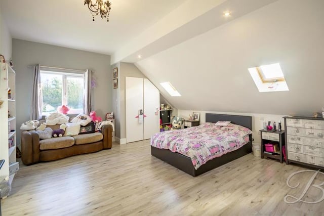 The second bedroom is so large that it has to be admired for its versatility. With laminate flooring, it boasts two Velux windows to the rear, a central-heating radiator and uPVC glazed window to the side.