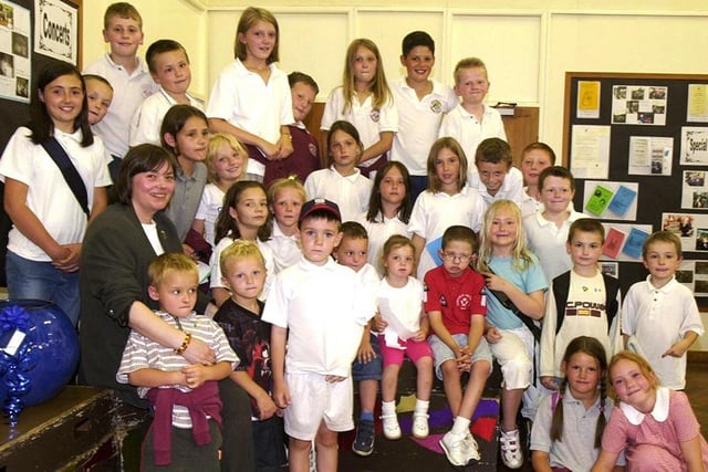 Head teacher Anne-Marie Morris (front left) pictured with some of the pupils from the Hazelbarrow School that closed for the last time on Friday, July 18, 2003