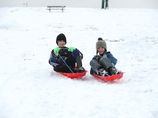 Danny Hampton (left), and Tomos Bullock both ten from Fareham enjoy the snow on Portsdown Hill .