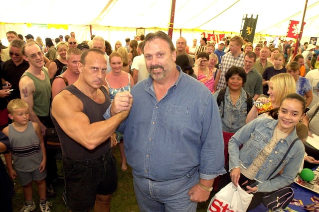 Gladiators star Wolf, the man TV audiences loved to hate, with strongman Geoff Capes in Sheffield