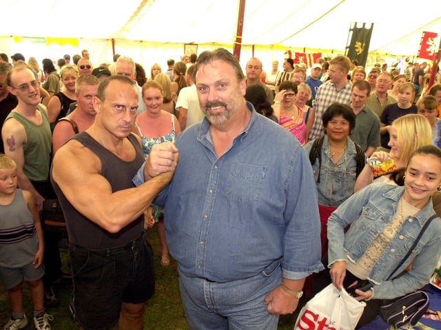 Gladiators star Wolf, the man TV audiences loved to hate, with strongman Geoff Capes in Sheffield