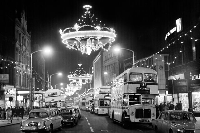 The lights shine brightly over a busy Fargate in the 1960s