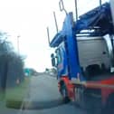 The moment driving instructor Steve Hewitt is forced to swerve off the road as a car transporter passes