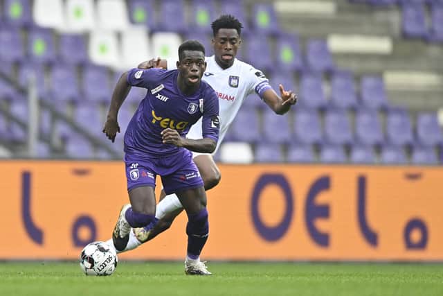 Beerschot's Isamaila Cheikh Coulibaly and Anderlecht's Albert Sambi Lokonga fight for the ball: JOHAN EYCKENS/BELGA MAG/AFP via Getty Images