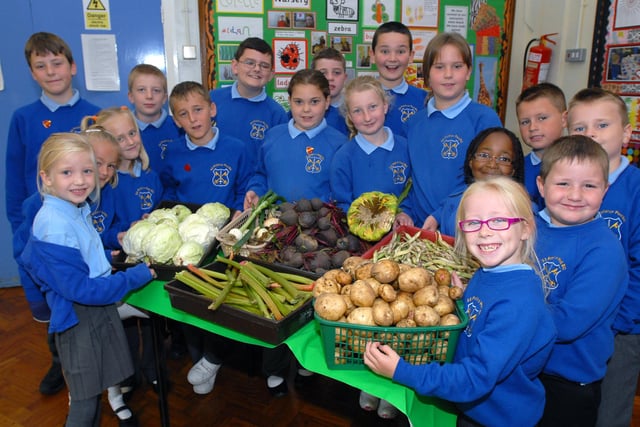 The school's gardening club is pictured with its first harvest in 2009. Is there someone you know in the picture?
