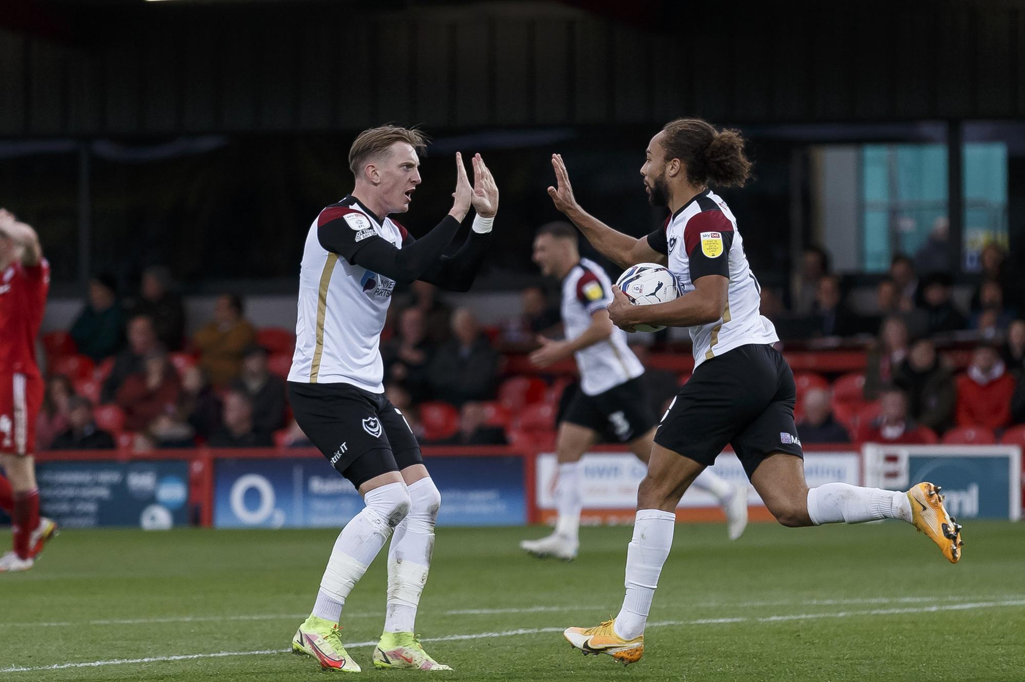 Marcus Harness celebrates with Ronan Curtis after netting Pompey's late leveller at Accrington. Picture: Daniel Chesterton/phcimages.com
