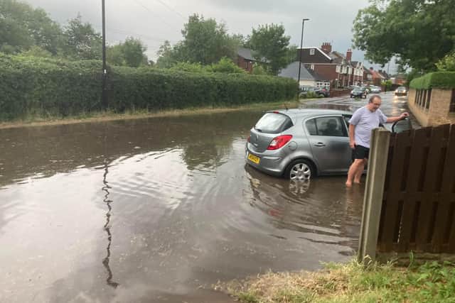 A road in Beighton was pictured submerged under water. Photo: Julie Clark