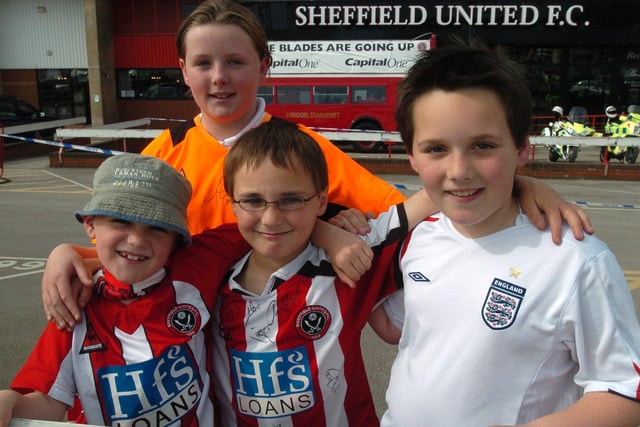 United fans wait outside Bramall Lane ahead of the open top bus parade to celebrate promotion to the Premier League in May 2006.