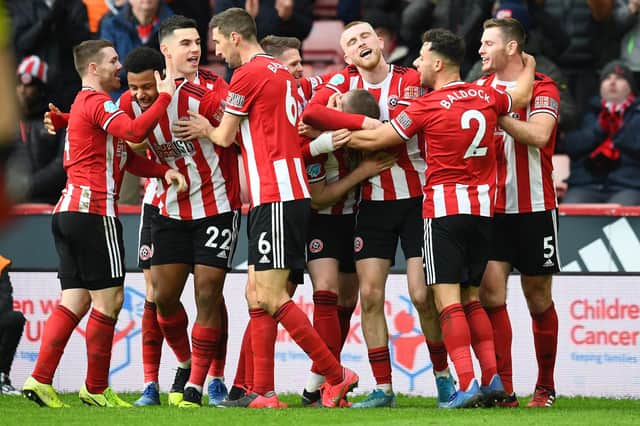 Sheffield United's John Lundstram celebrates with his team mates after scoring his team's second goal during the Premier League match between Sheffield United and AFC Bournemouth at Bramall Lane on February 9, 2020 - the Blades won the game 2-1