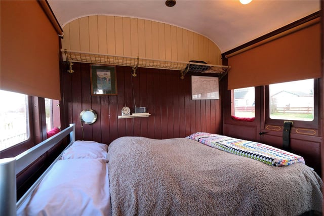 One of the bedrooms in the former railway carriage.