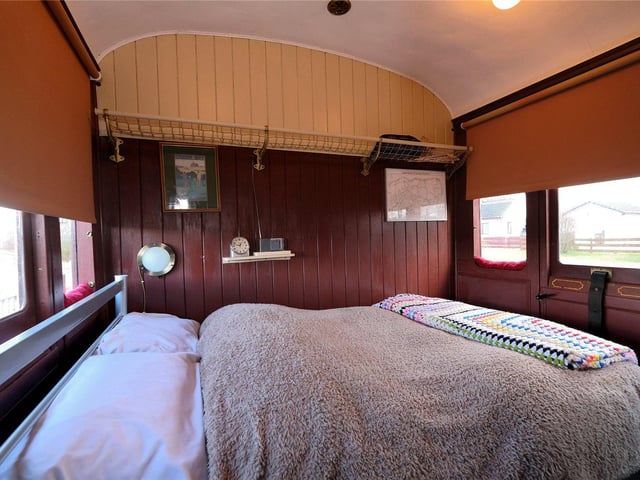 One of the bedrooms in the former railway carriage.