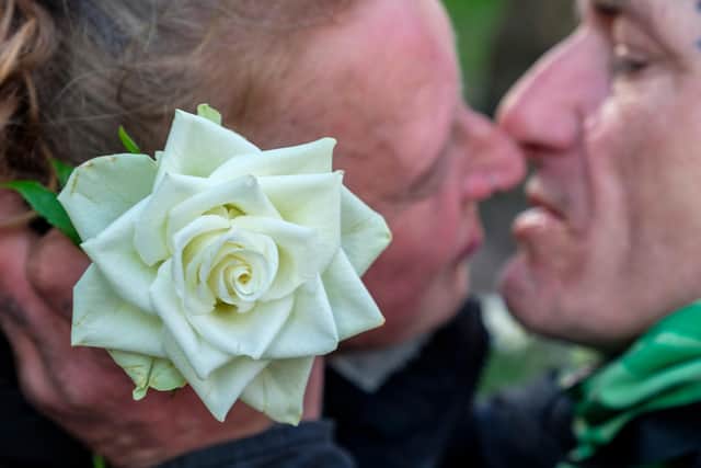 The couple who had been arguing and the rose the woman was given, pictured by Mark Harvey