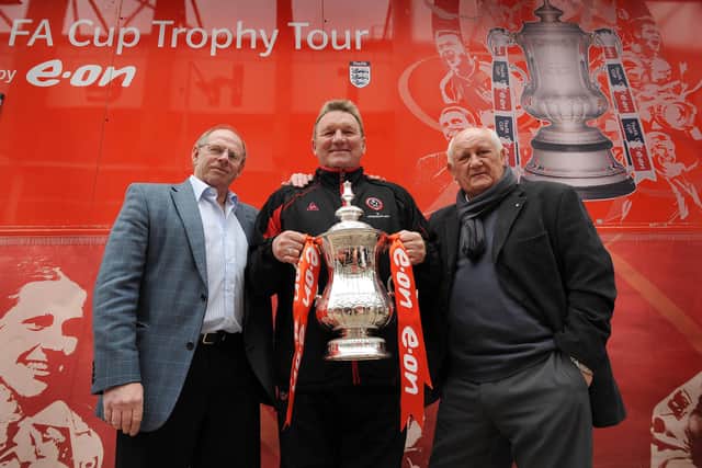 Pictured at Bramall Lane with the FA CUP, are three Blades Legends, Left Back Ted Hemsley, Right Back, Len Badger, and Middfielder Tony Currie.