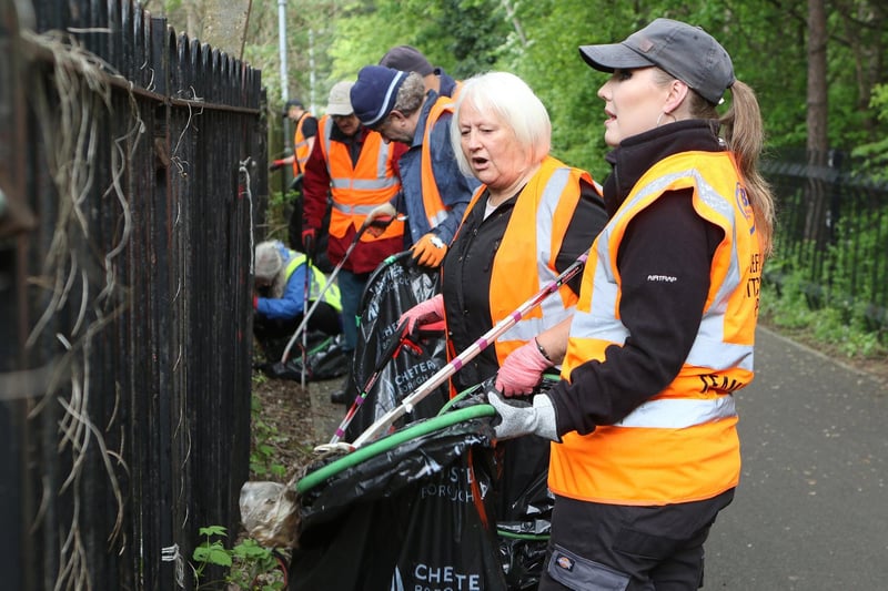 The volunteer litter pickers get stuck into the area behind the Casa Hotel.
