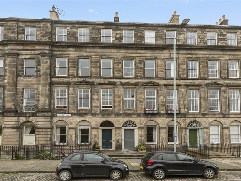 Front of building - flat entrance is dark blue door on left.