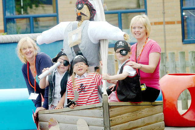 A pirate scarecrow joined these people for a fun event ten years ago but who can tell us more about it?