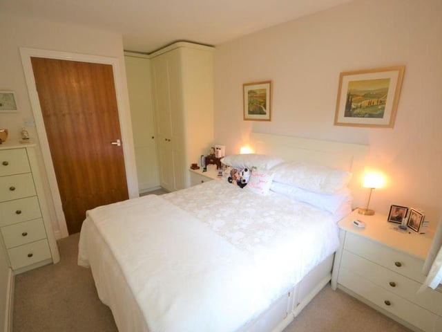 Bedroom 1 - A well presented double bedroom enjoying a pleasant outlook from a front facing UPVC double glazed window, having a superb range of stylish fitted wardrobes, offering a combination of hanging rails and storage space, matching fitted drawers and bedside drawers, various power sockets and a central heating radiator.