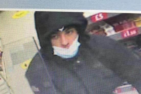 Police want to speak to this man about a robbery at a newsagent in Rotherham.