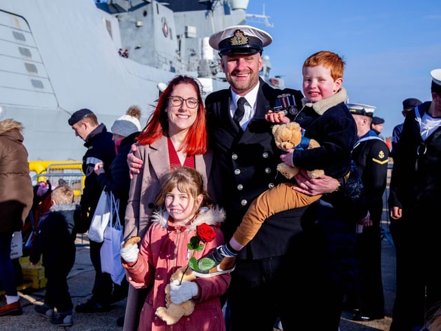 Steph Leonard with husband Lt Cdr Tom Leonard and their children Penny, seven, and Sebby, four, at HMS Diamond's homecoming. Picture: Habibur Rahman