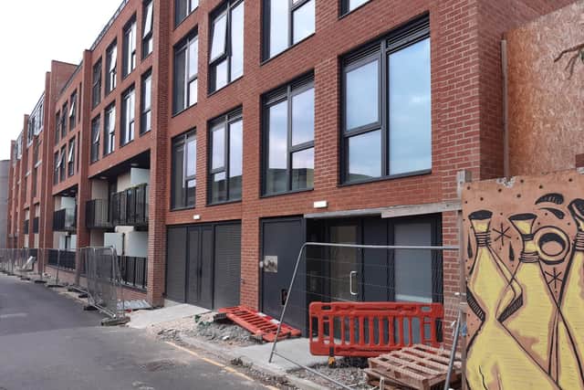 Residents living in the Lightbox apartment block on Earl Street in Sheffield city centre are still waiting for the pavement outside to be completed by the developer