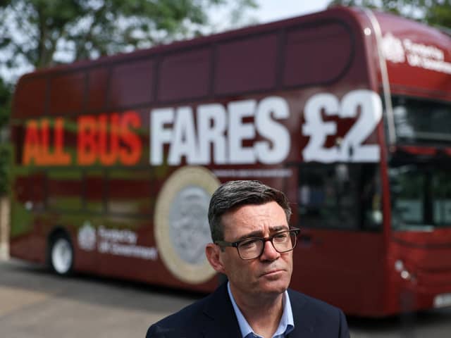Prime Minister Andy Burnham speaking to members of the media in front of a FirstGroup bus. PIC: Toby Melville/PA Wire