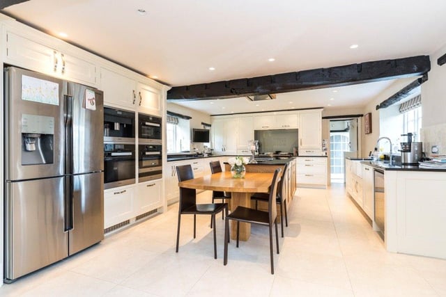 The 31ft kitchen provides plenty of space for family dining and has been beautifully decorated with bespoke pine units, integrated appliances, an Aga and space for an American-style fridge.