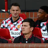 Harry Maguire and Luke Shaw of Manchester United look on from the bench (Michael Regan/Getty Images)