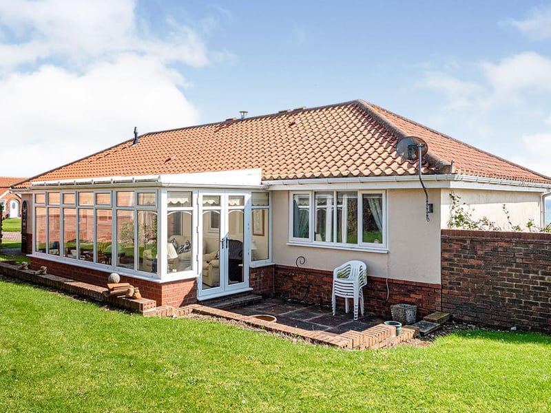 The large conservatory offers dual-aspect doors into the rear garden.