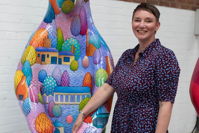 Sheffield Children's Acting Chief Executive Ruth Brown with Sue Guthrie's City of Trees, sponsored by The Star.