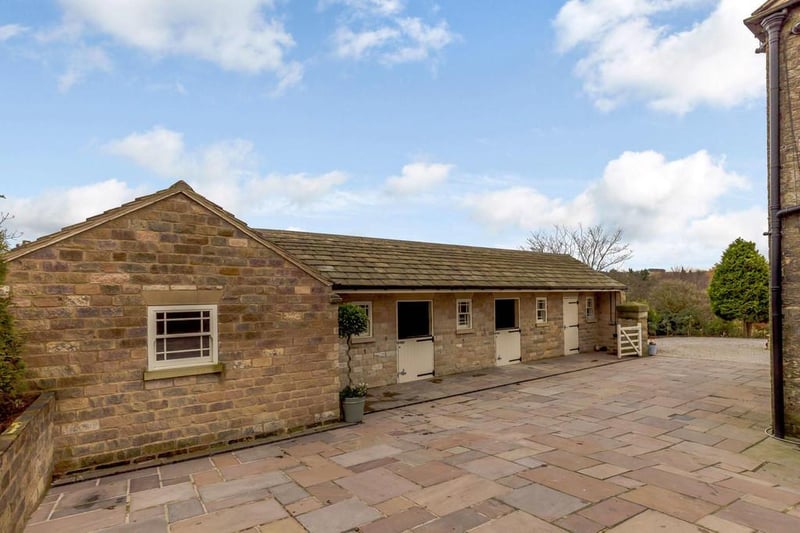 The brochure says: "Beautifully constructed this stone building houses three large loose boxes, a spacious tack room with laundry capabilities and hay store and is complete with a separate four acres of ring-fenced paddocks."