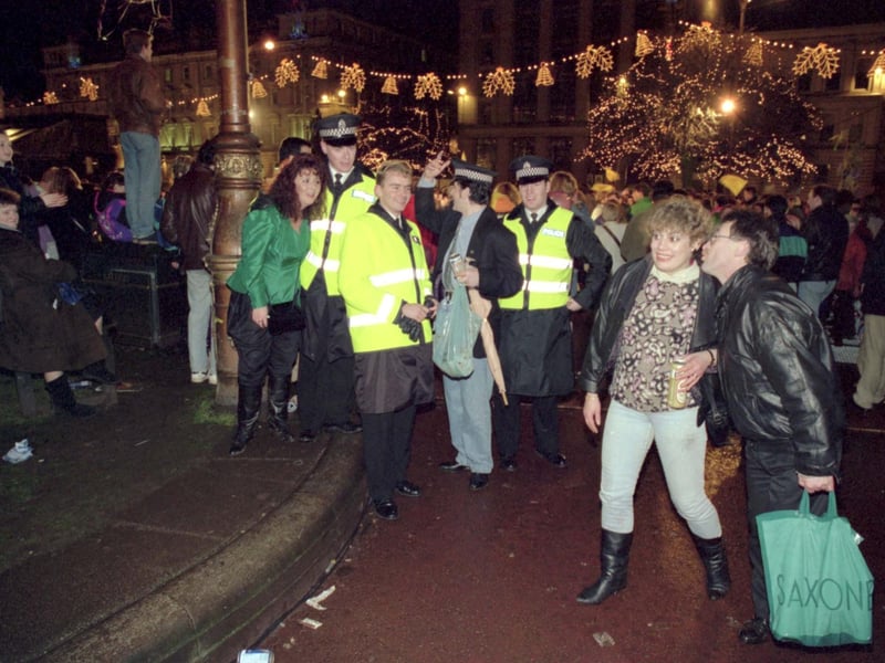 Police join celebrations at George Square in 1990.