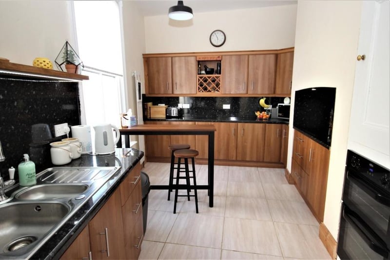 The kitchen is fitted with 'marble' effect looking surfaces.