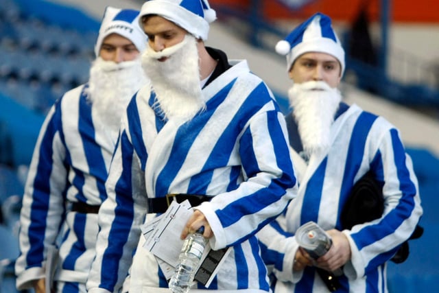 Wednesday fans in their blue and white-striped Santa outfits in December 2013.