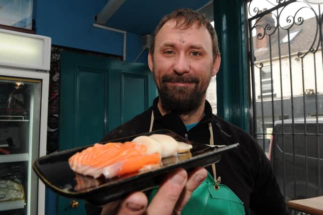Christian Szurko, manager of H.H. Mann Fishmongers, Sharrow Vale Road, with a scallop and salmon platter.