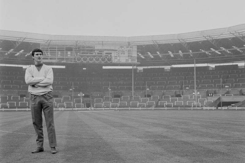 Jim Baxter inspects the Wembley pitch prior to leading Scotland to a 2-1 win over Englan  in April 1963