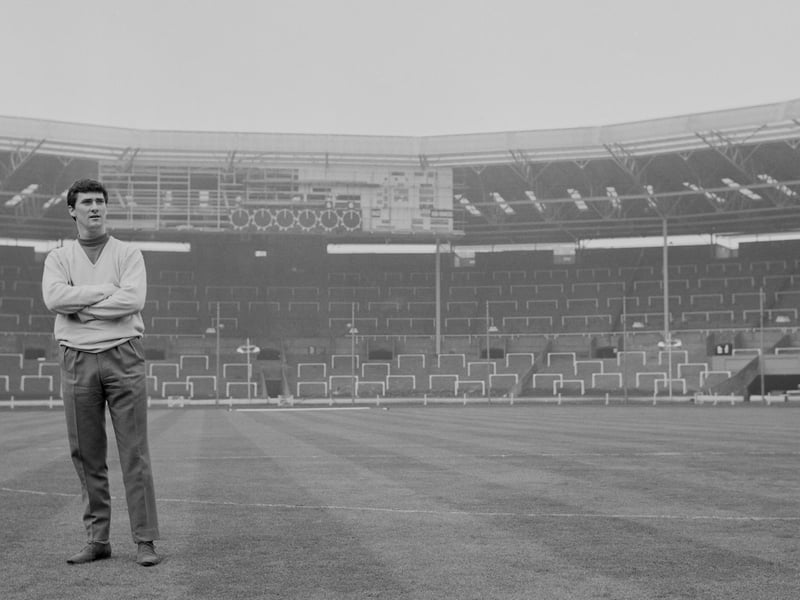 Jim Baxter inspects the Wembley pitch prior to leading Scotland to a 2-1 win over Englan in April 1963