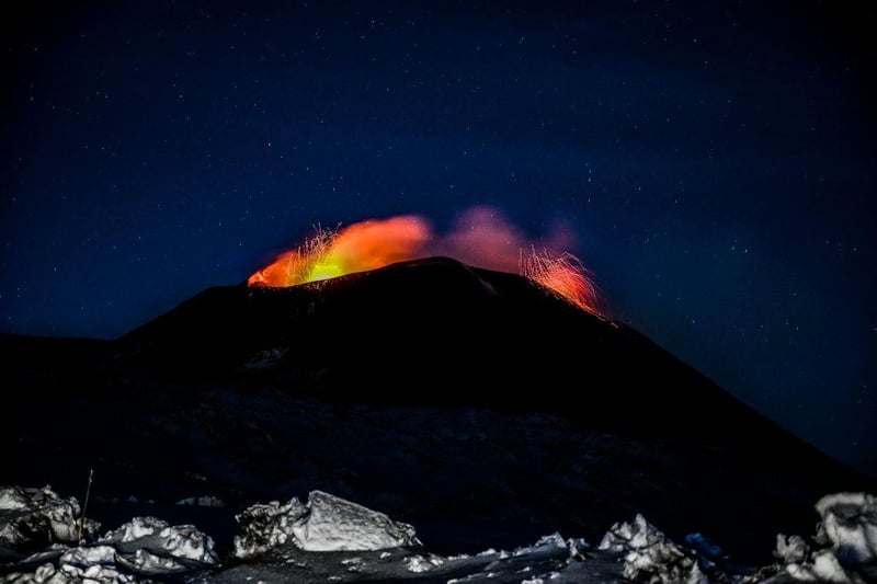 A night view of the Strombolian activity of the summit craters of the volcano Etna, photographed from an altitude of 2,900 metres, with explosions visible. (Photo by Fabrizio Villa/Getty Images)
