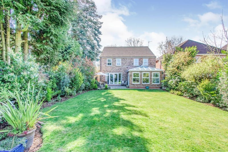 Good sized landscaped garden to the rear which has a range of evergreen, mature shrubs and trees to the borders.