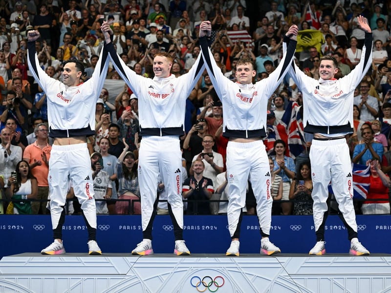 Gold medallists James Guy, Tom Dean, Matthew Richards and Duncan Scott retained their title and stand on the podium after winning gold in the men's 4x200m freestyle relay swimming final.