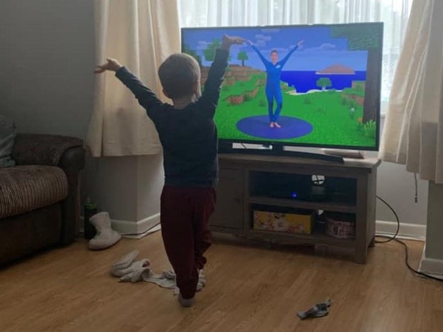Like a metropolitan thirty-something, young Toby likes to begin his day with a bit of yoga.